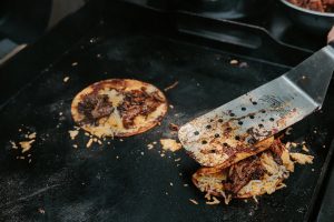 Finish birria tacos on the griddle