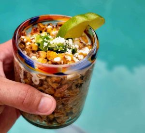 Garnish with a lime, Elotes or Mexican Street Corn