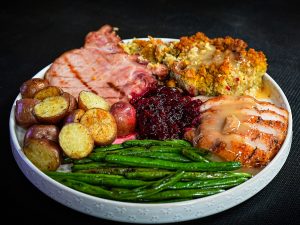 Thanksgiving meal served with corn bread dressing.